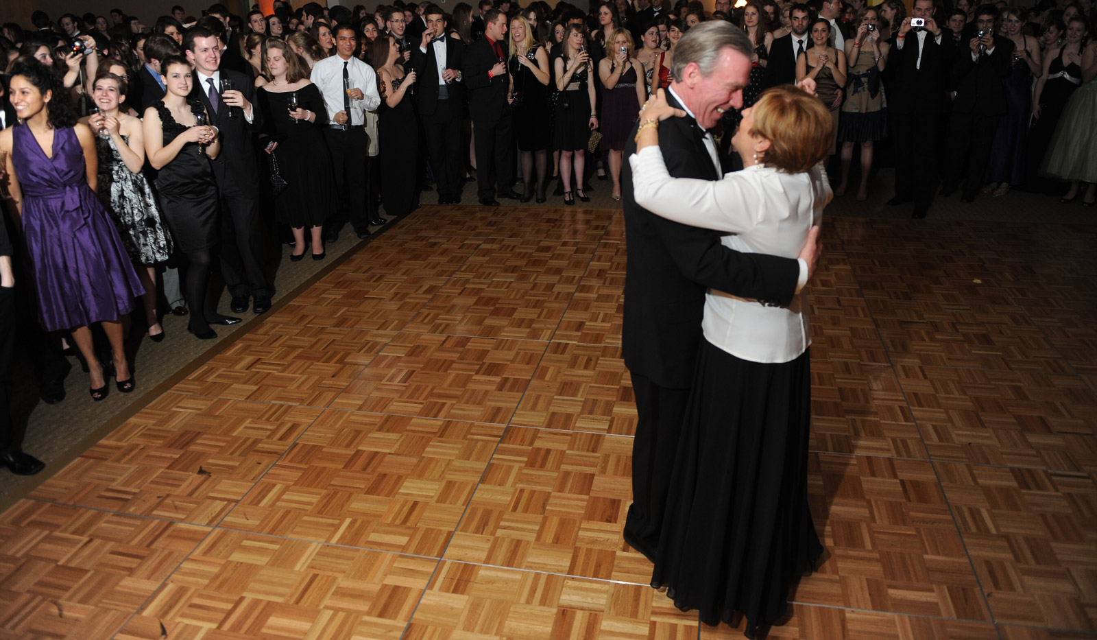 John and Jeanne Garvey dance as students look on